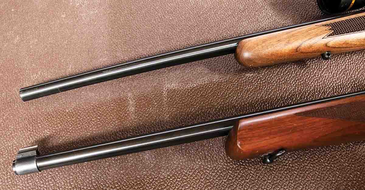 The new rifle (top) features a clean barrel while Lee’s 1970s version has open sights.
